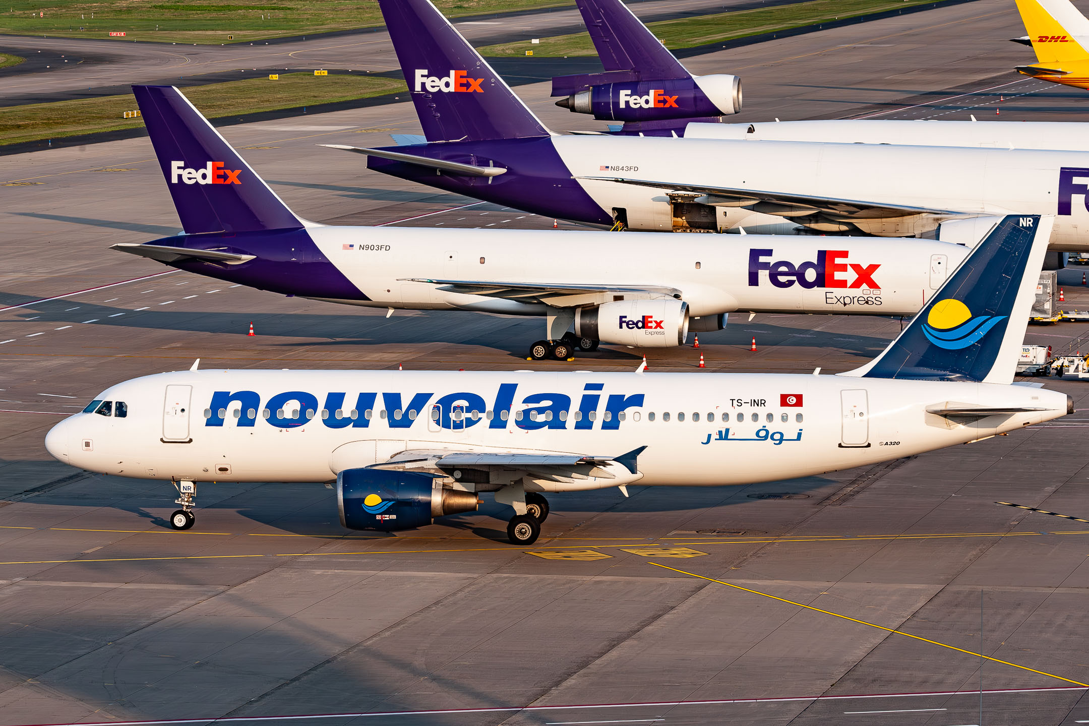 Nouvelair Tunisie Airbus A320-200 "TS-INR" taxiing on the apron at Köln Bonn Airport on a clear summer evening. July 2021