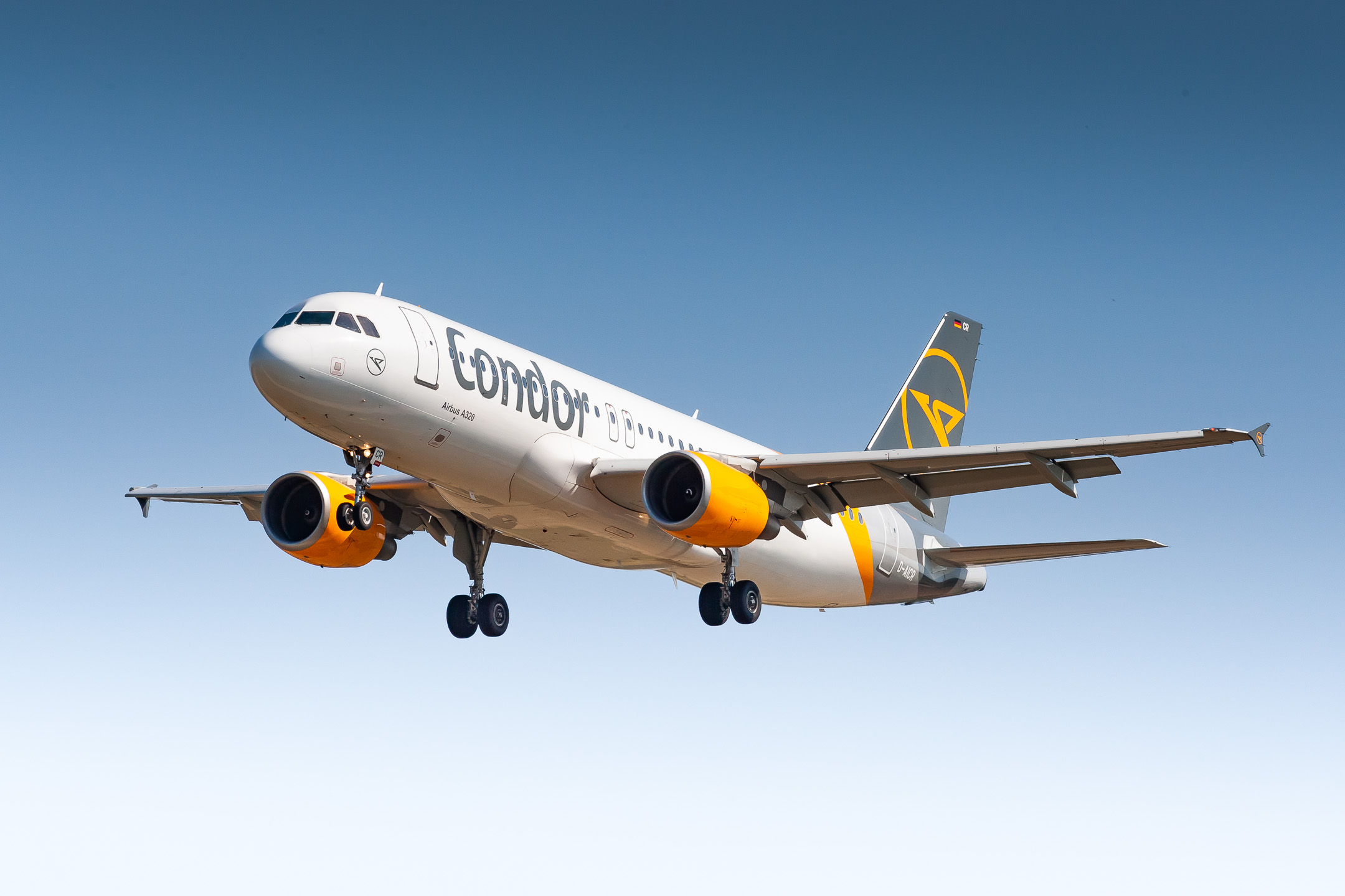 Condor Airbus A320-200 "D-AICR" on short final for runway 25 at Stuttgart Airport on a very hot summer day, August 2021.