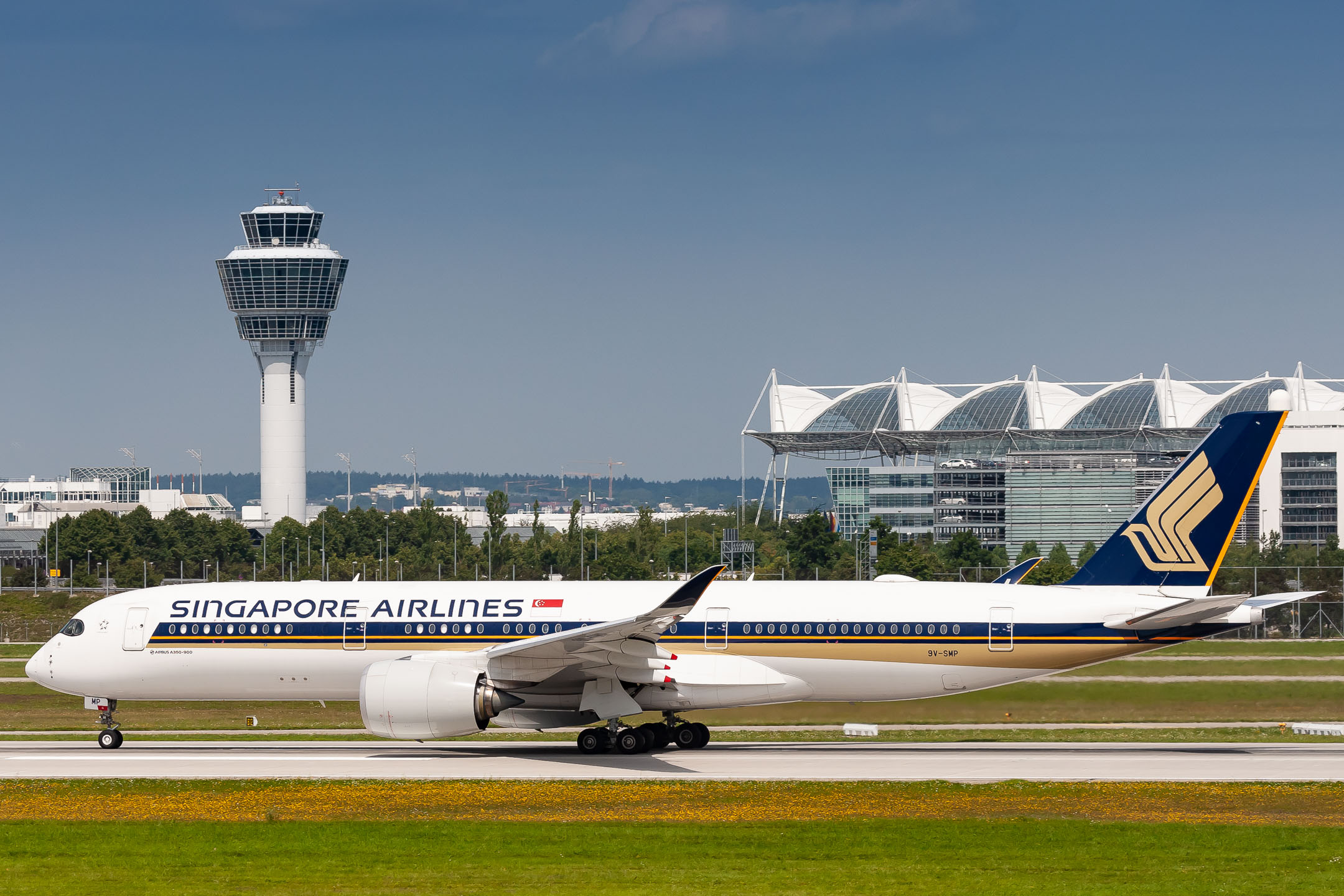 Singapore Airlines Airbus A350-900 "9V-SMP" accelerating on runway 26 left at Munich Airport on a very hot summer afternoon, August 2021