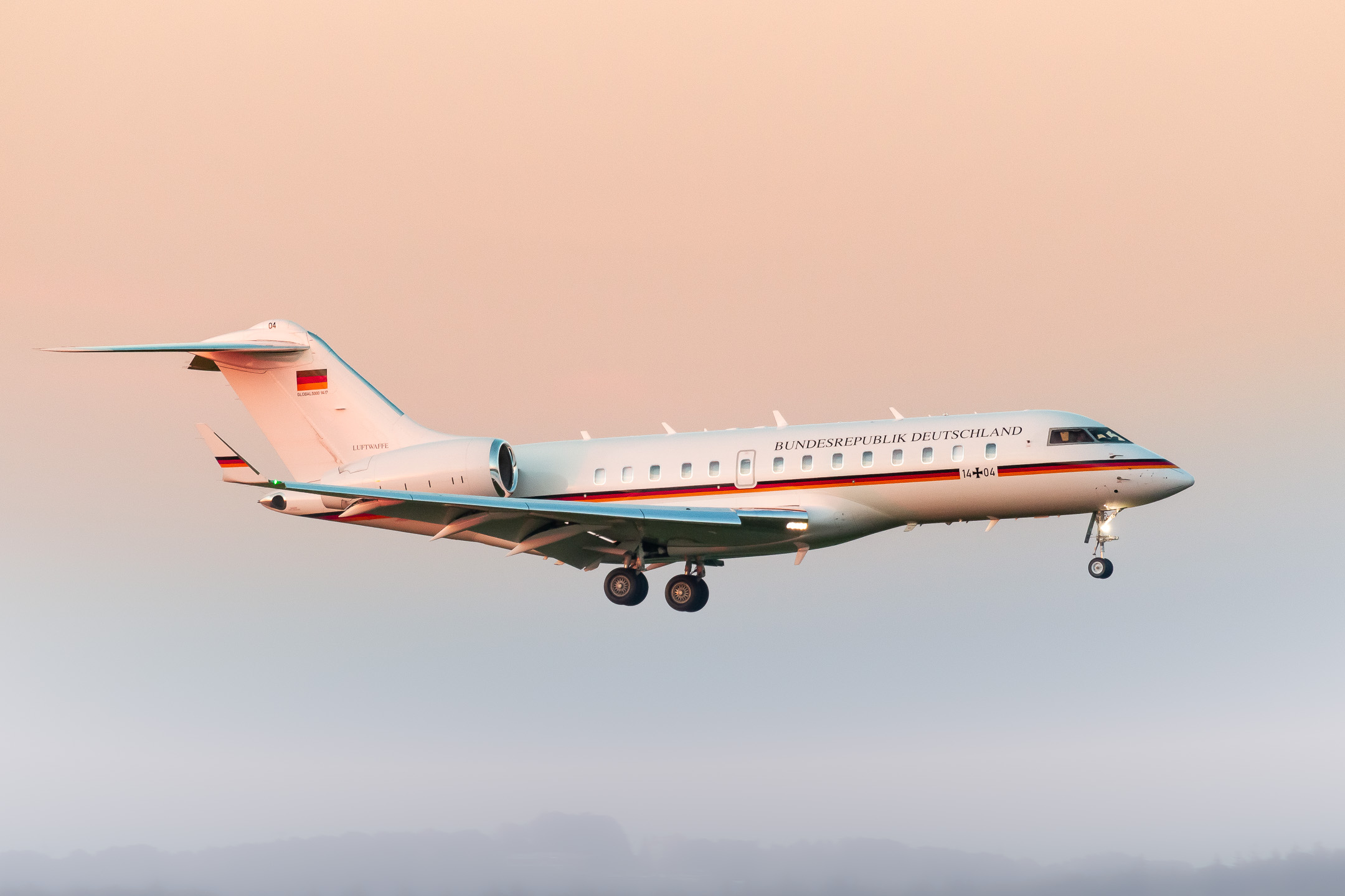 Luftwaffe Bombardier Challenger (Registration "14+04") coming in on runway 14 left at Köln Bonn Airport on an hazy late summer evening, September 2021.