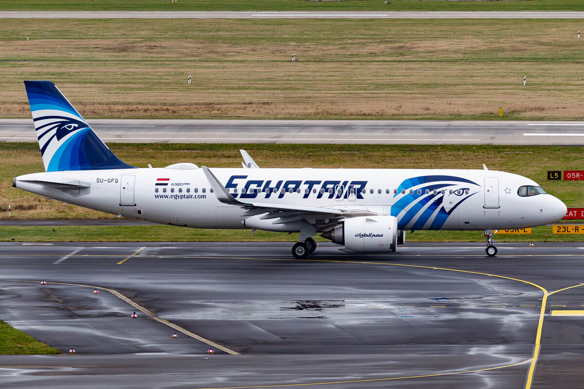 Egyptair Airbus A320neo "SU-GFQ" taxiing to the active runway 23 left at Düsseldorf Airport on a rainy winter afternoon, January 2022