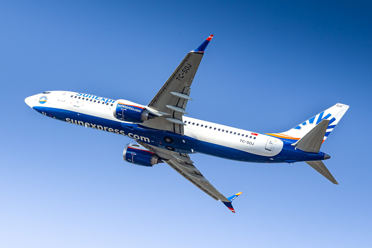 SunExpress Boeing 737 MAX 8 "TC-SOJ" departing out of runway 23L at Düsseldorf airport, February 2022.