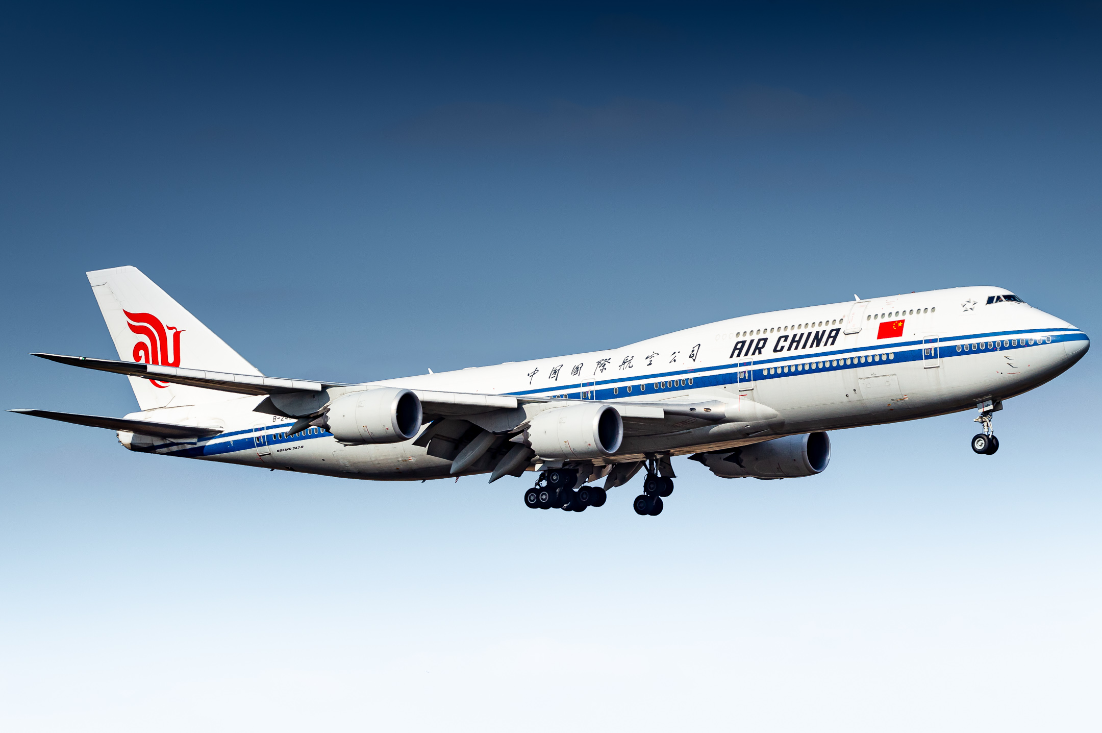 Air China Boing 747-8 "B-2480" on short final for runway 07 center at Frankfurt Airport on a cold spring morning, March 2022.