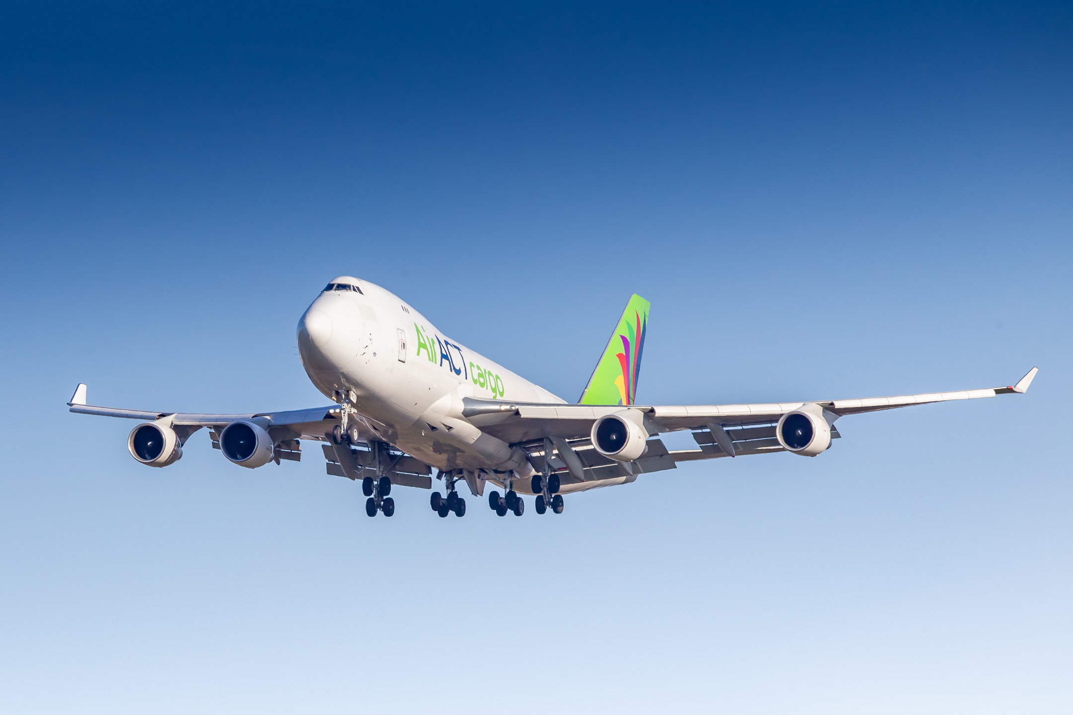 Air ACT Cargo Boeing 747 on short final for runway 32R at Cologne Bonn airport on a bright spring afternoon, April 2022.