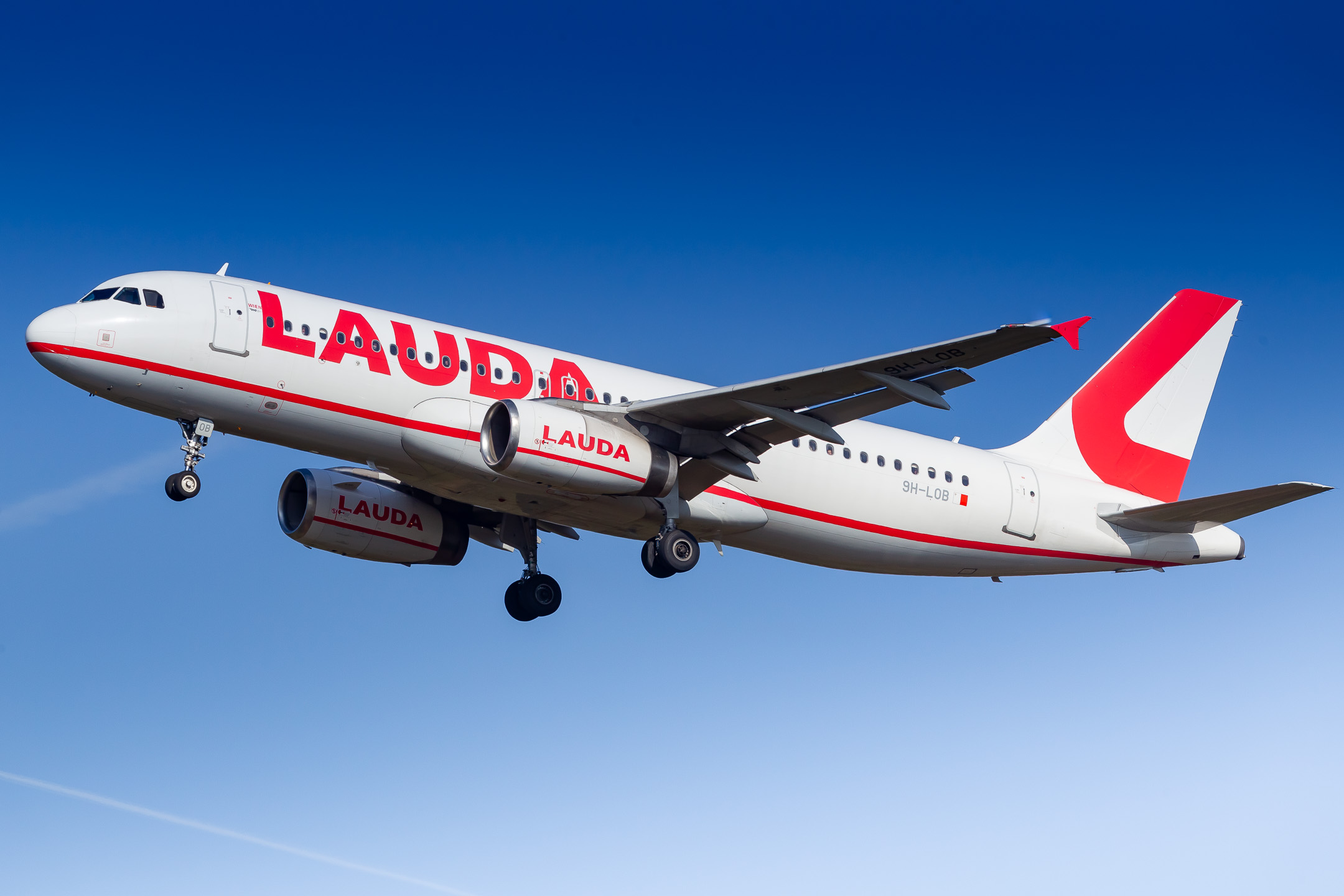 Lauda Air Airbus A320-200 "9H-LOB" on short final for runway 32R at Köln Bonn Airport on a warm and sunny spring afternoon, April 2022