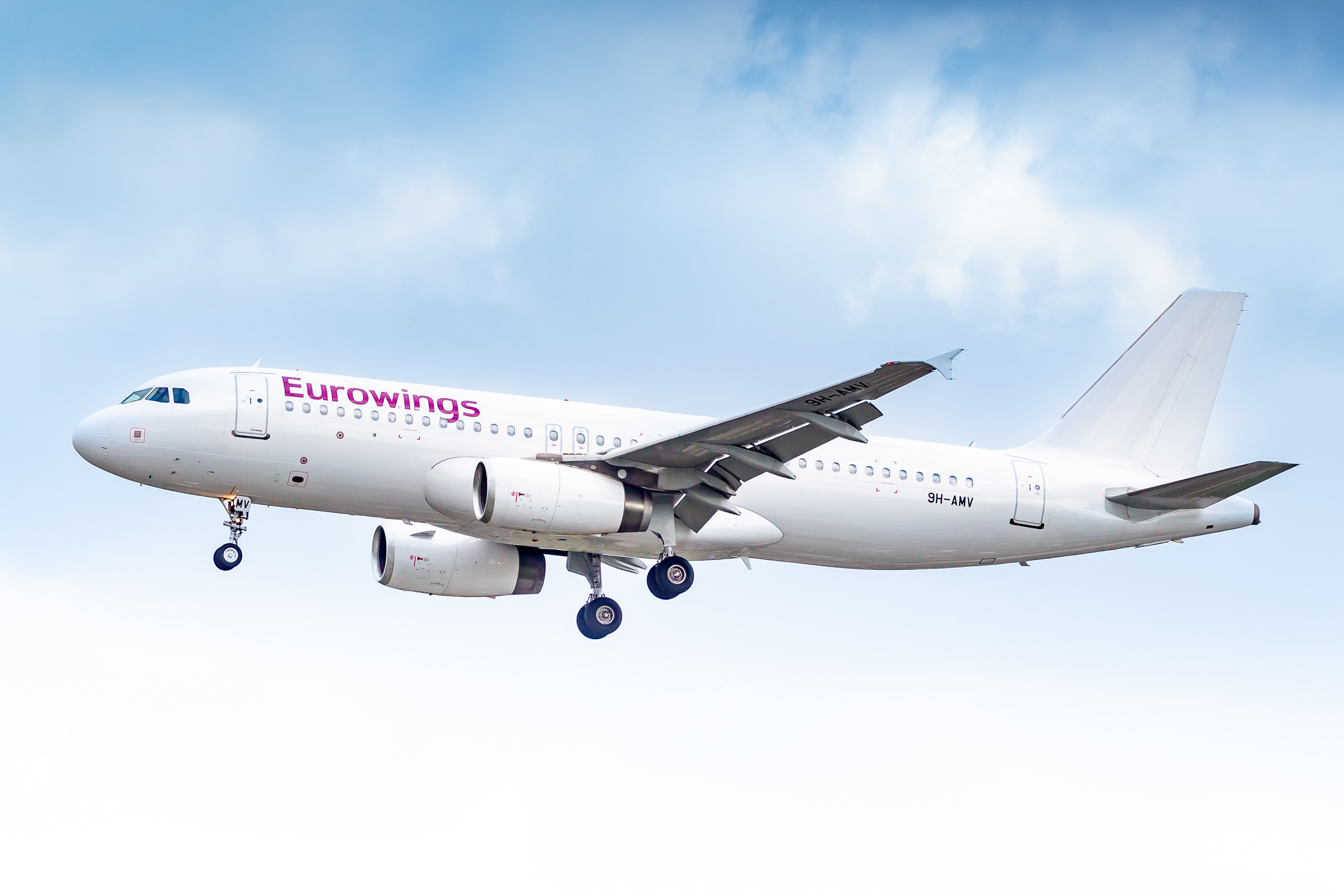 Eurowings Airbus A320-200 ("9H-AMV" operated by Avion Express Malta) on short final for runway 23 right at Düsseldorf Airport on a warm spring afternoon, April 2022