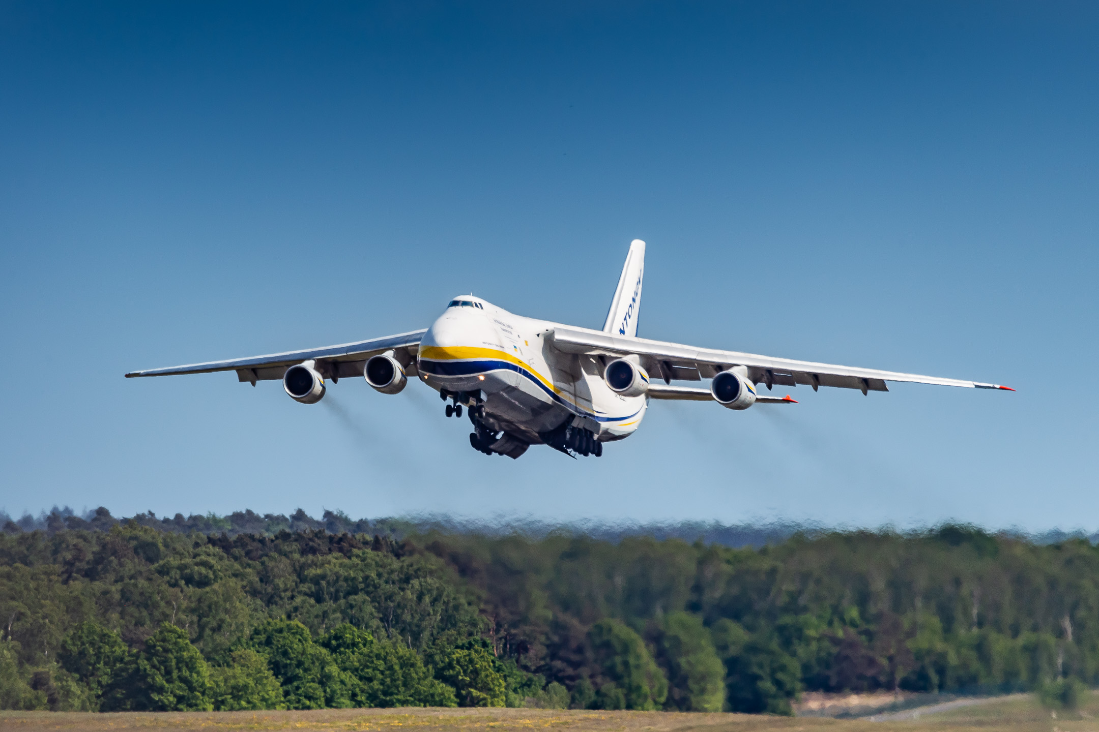 Antonov Airlines An-124 "UR-82027" taking off from runway 32R at Köln Bonn Airport on a hot summer afternoon, May 2022.