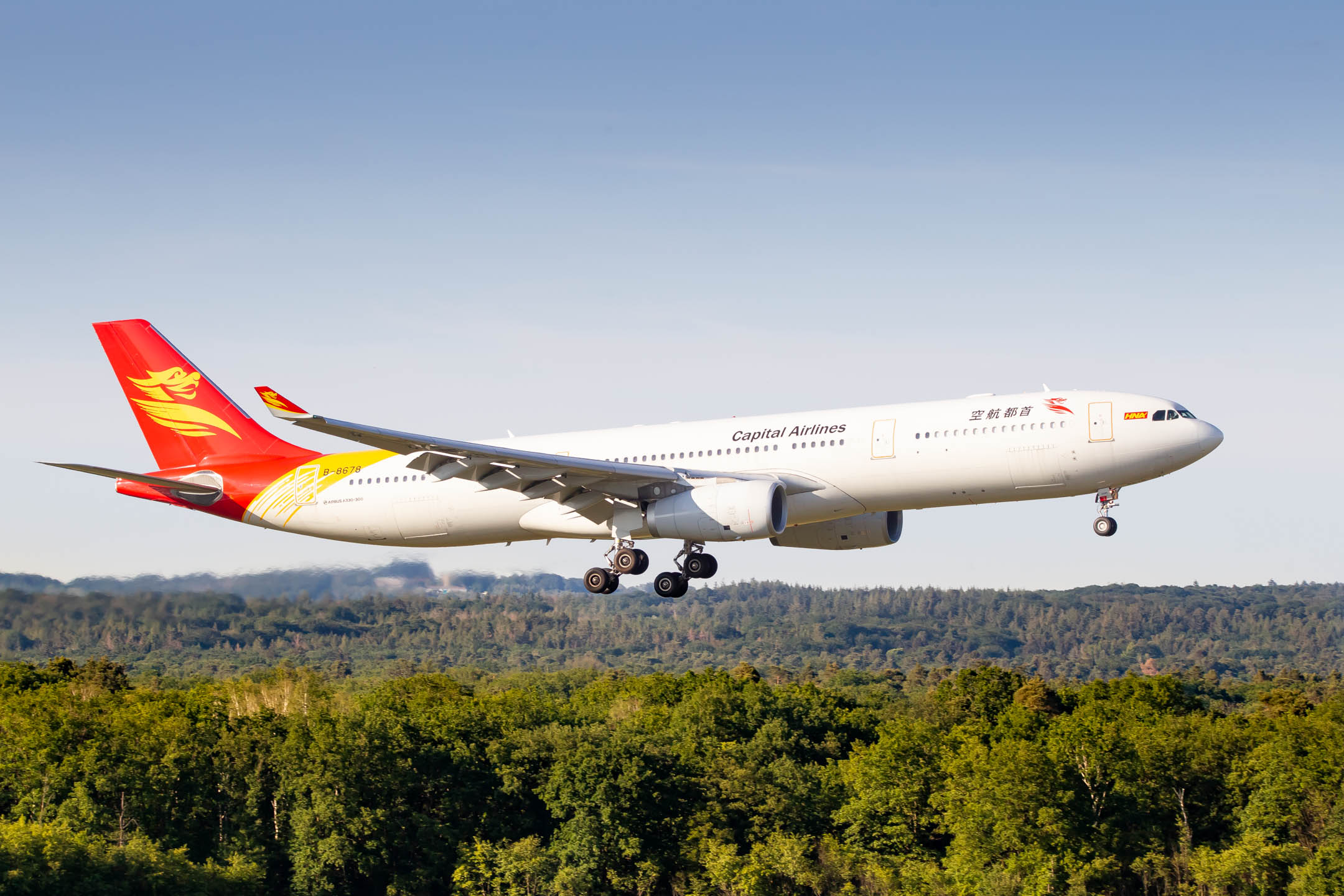 Capital Airlines Airbus A330-300 "B-8678" right before touchdown on runway 14L at Köln Bonn Airport, June 2022.