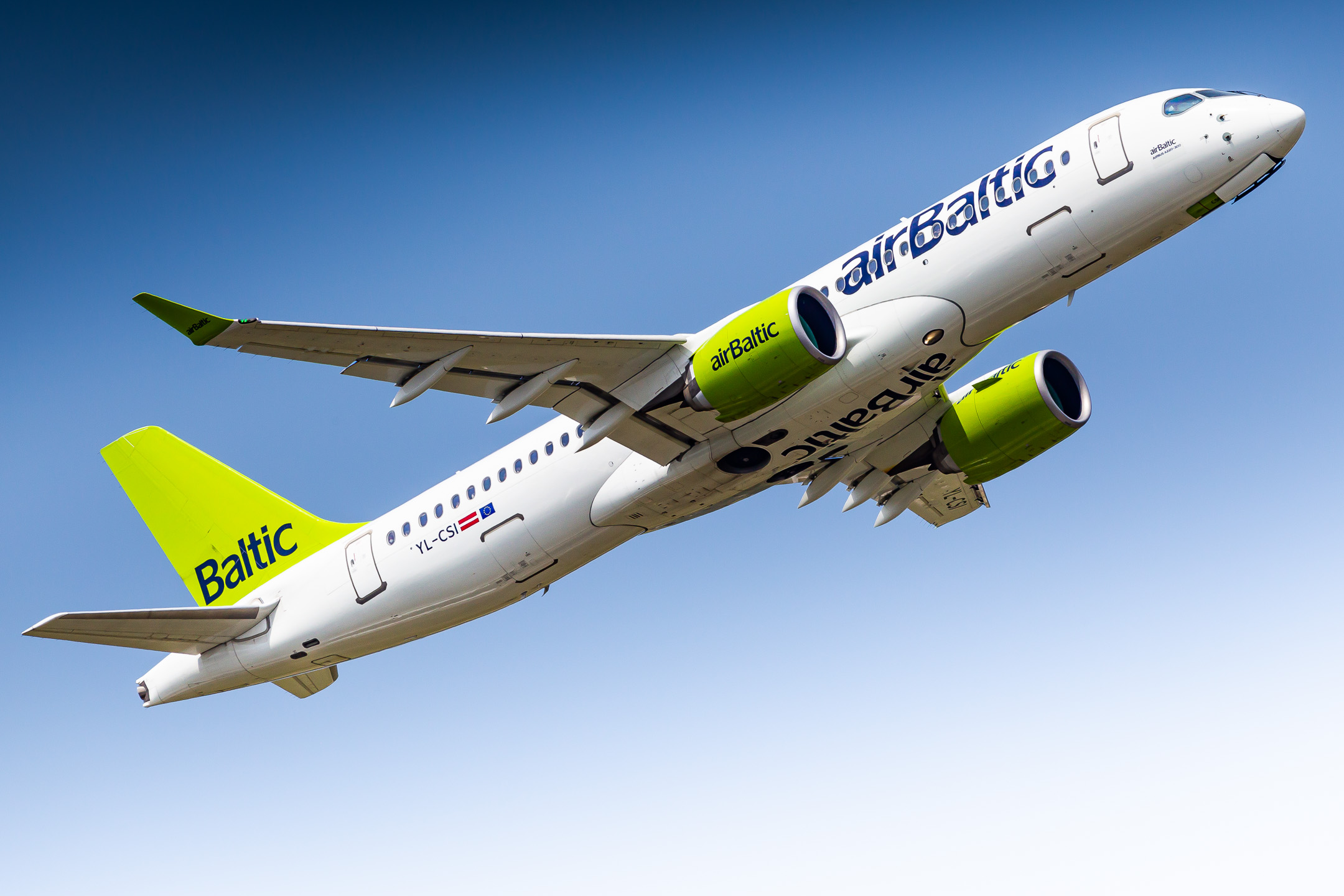 Baltic Air Airbus A220-300 taking off from runway 05R at Düsseldorf Airport on a sunny summer morning, June 2022