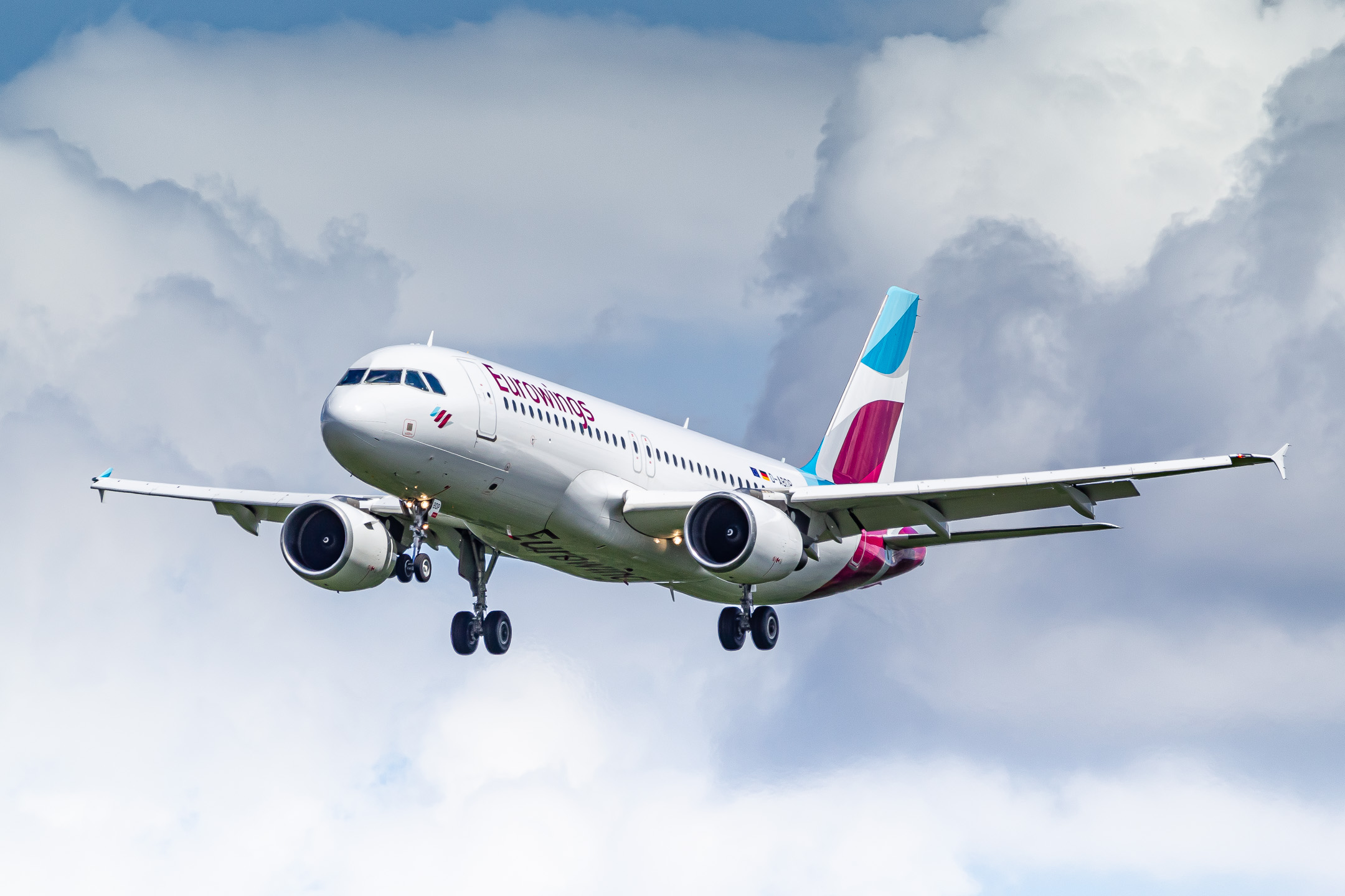 Eurowings Airbus A320-200 "D-ABDP" on short final for runway 23 left at Düsseldorf Airport on a cloudy summer morning, June 2022