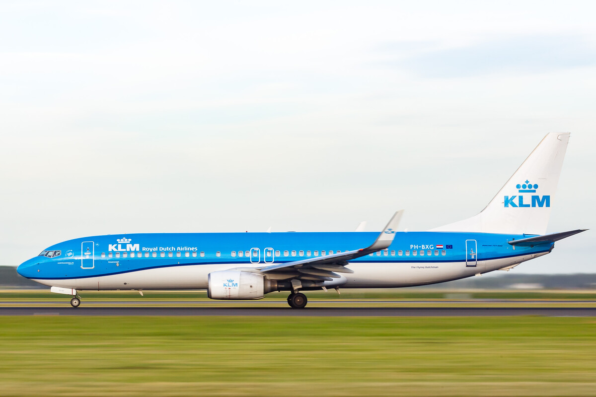 KLM Boeing 737-800 "PH-BXG" accelerating on the Polderbaan runway at Amsterdam Schiphol Airport on a cloudy summer afternoon, July 2022