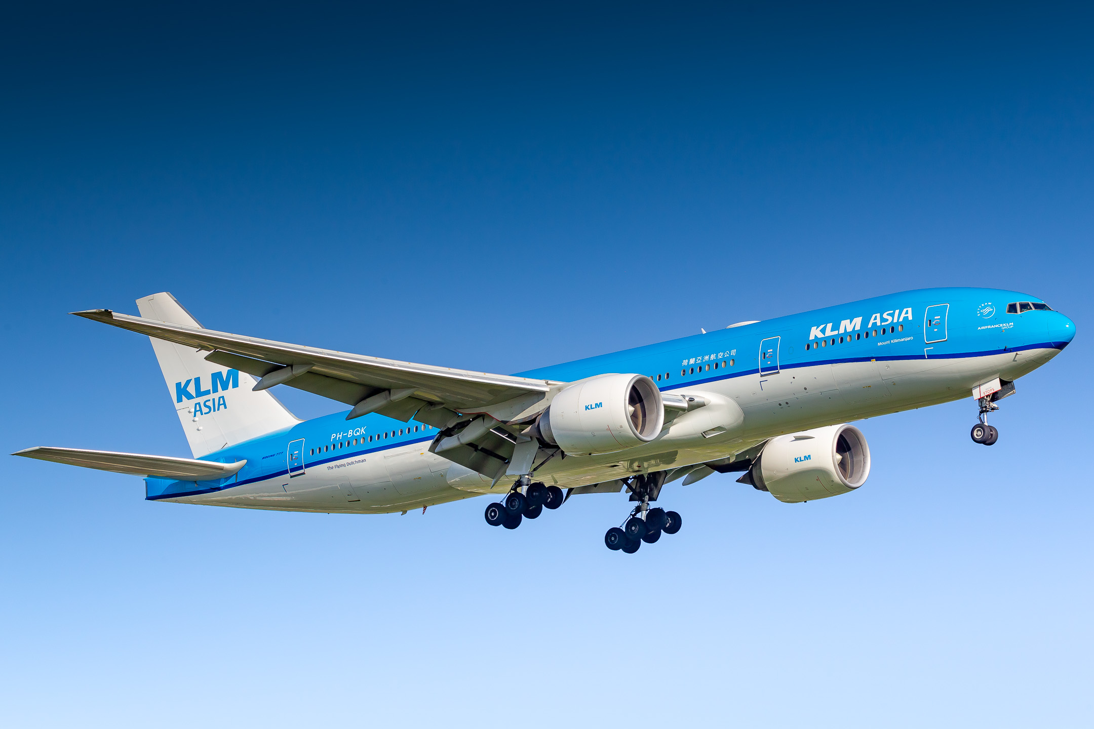 KLM Boeing 777-200 "PH-BQK" named "Mount Kilimanjaro" on short final for Amsterdam Schiphol Airport on a fresh summer morning, July 2022