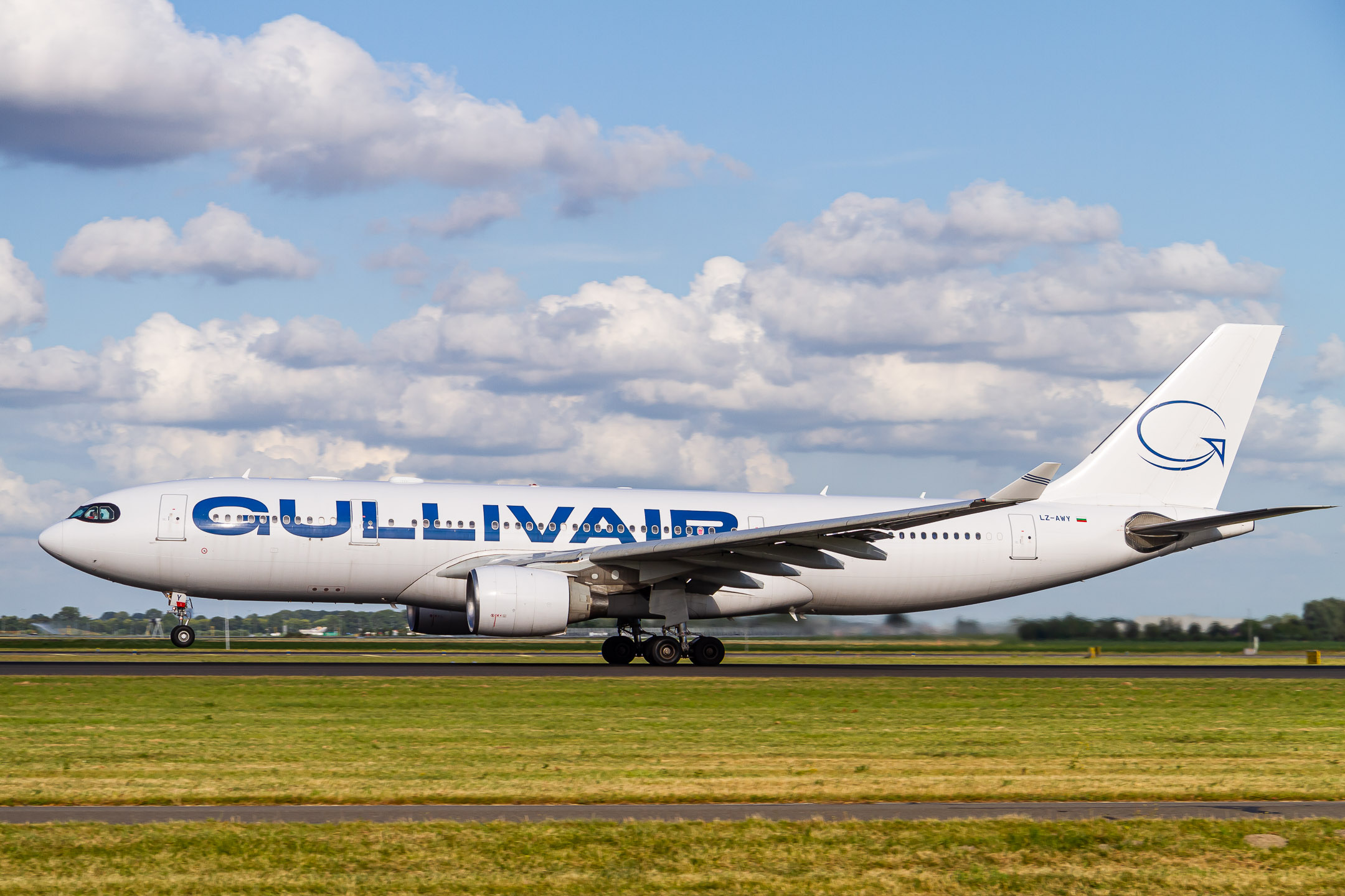 GullivAir Airbus A330-200 "LZ-AWY" taking off from Polderbaan at Amsterdam Schiphol Airport on a hot summer afternoon, July 2022.