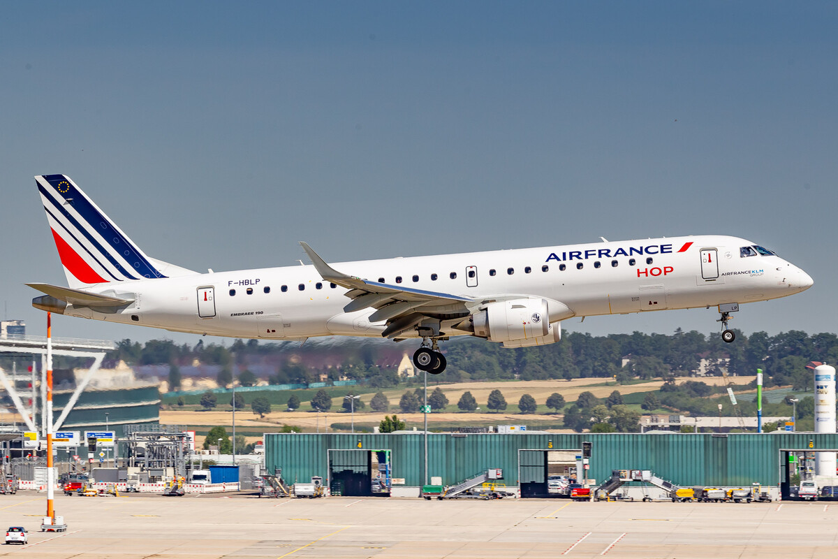 Air France Hop Embraer ERJ-190STD "F-HBLP" right before touchdown on runway 07 at Stuttgart Airport on a very hot summer morning, July 2022.