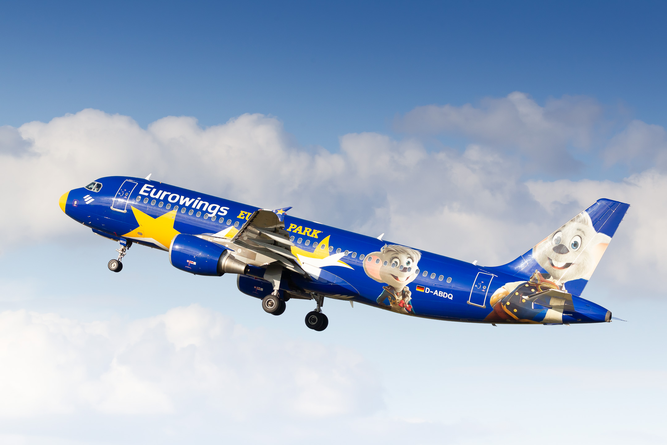 Eurowings Airbus A320-200 "D-ABDQ" with the Europapark livery taking off from runway 33 at Hamburg Fuhlsbüttel Airport on a warm summer evening, July 2022.