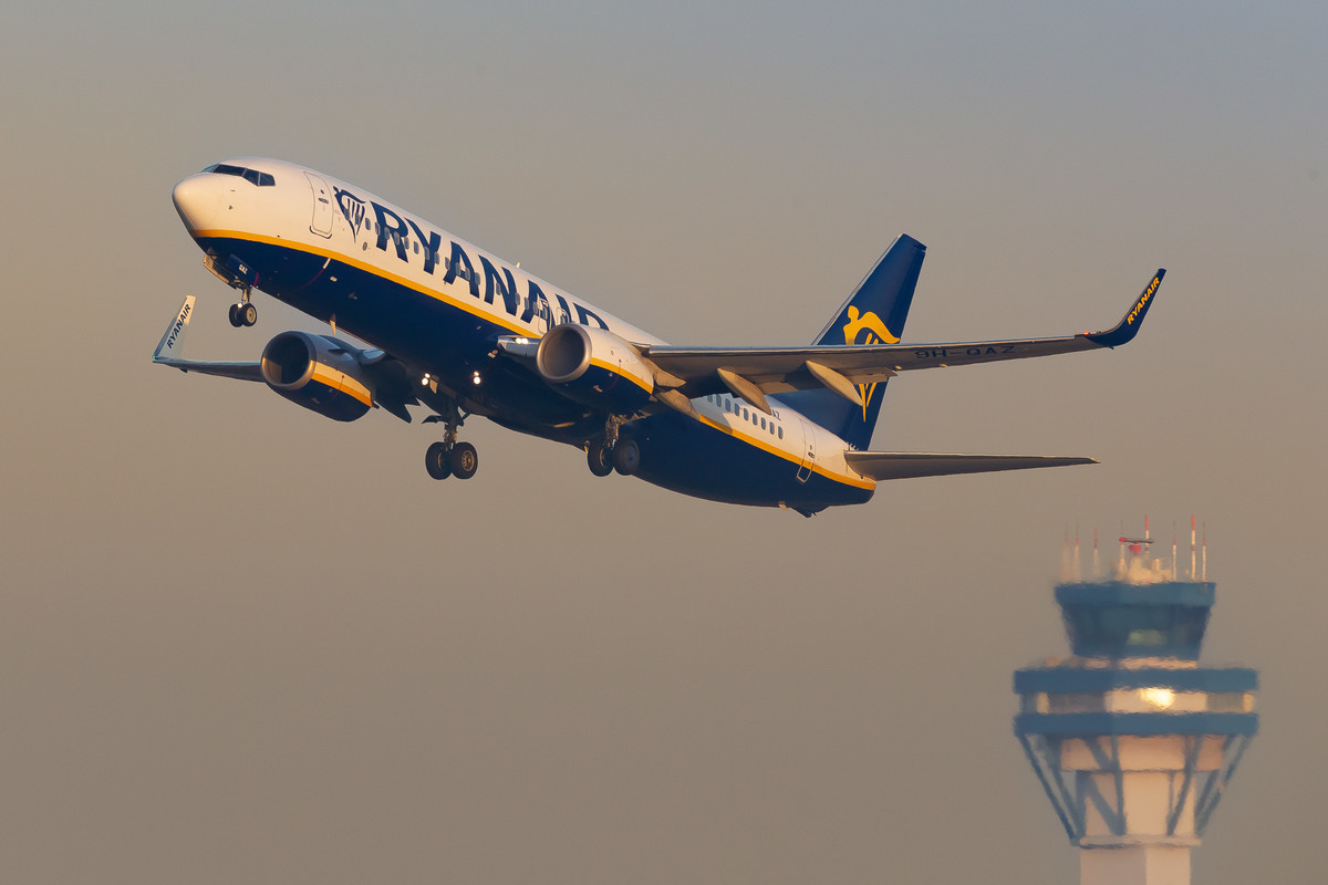 Ryanair Boeing 737-800 "9H-QAZ" taking off from runway 14L at Köln Bonn Airport right before sunrise on a very early summer morning, August 2022.