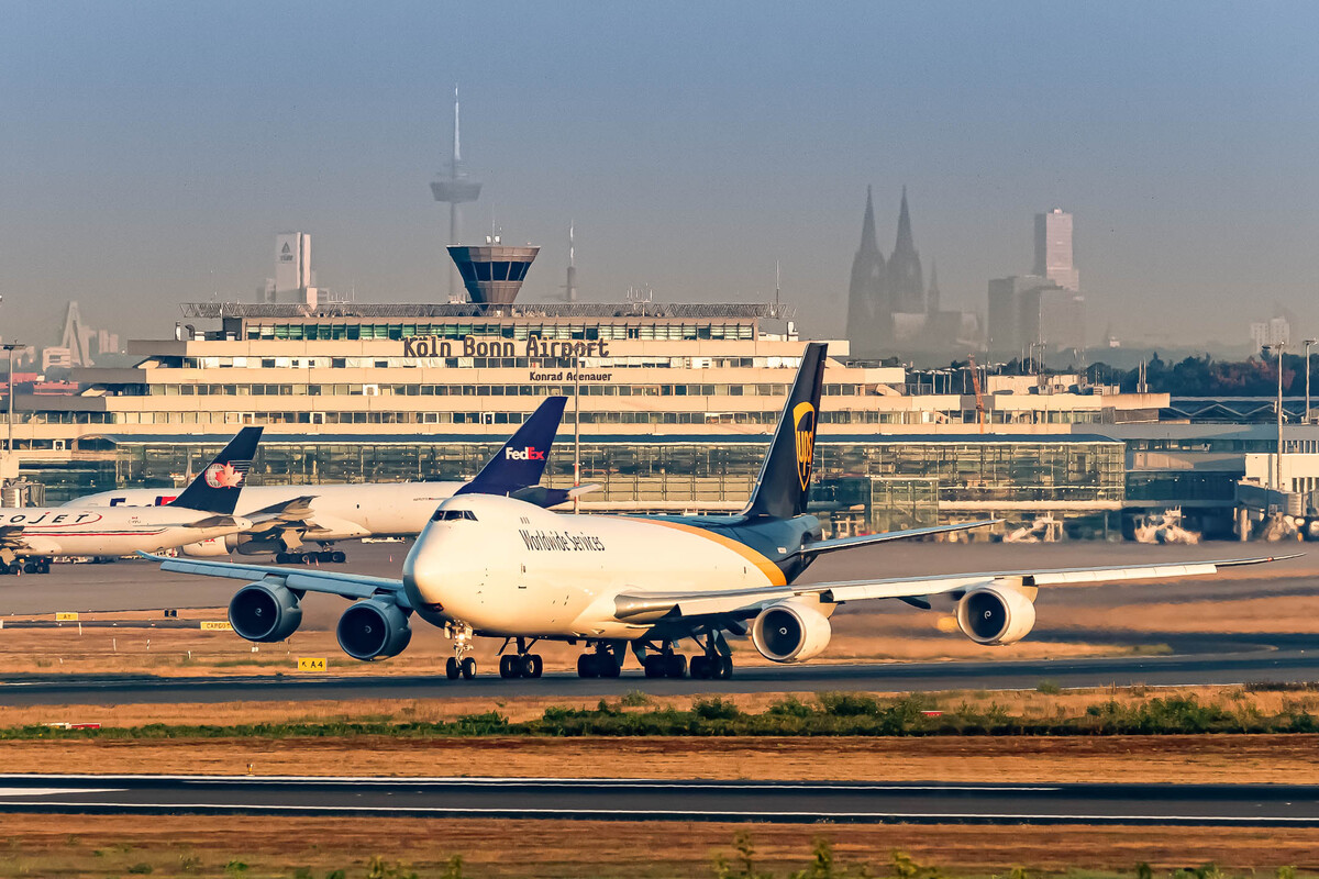 UPS Airlines Boeing 747-8F taking off from runway 14 left on an early summer morning, August 2022