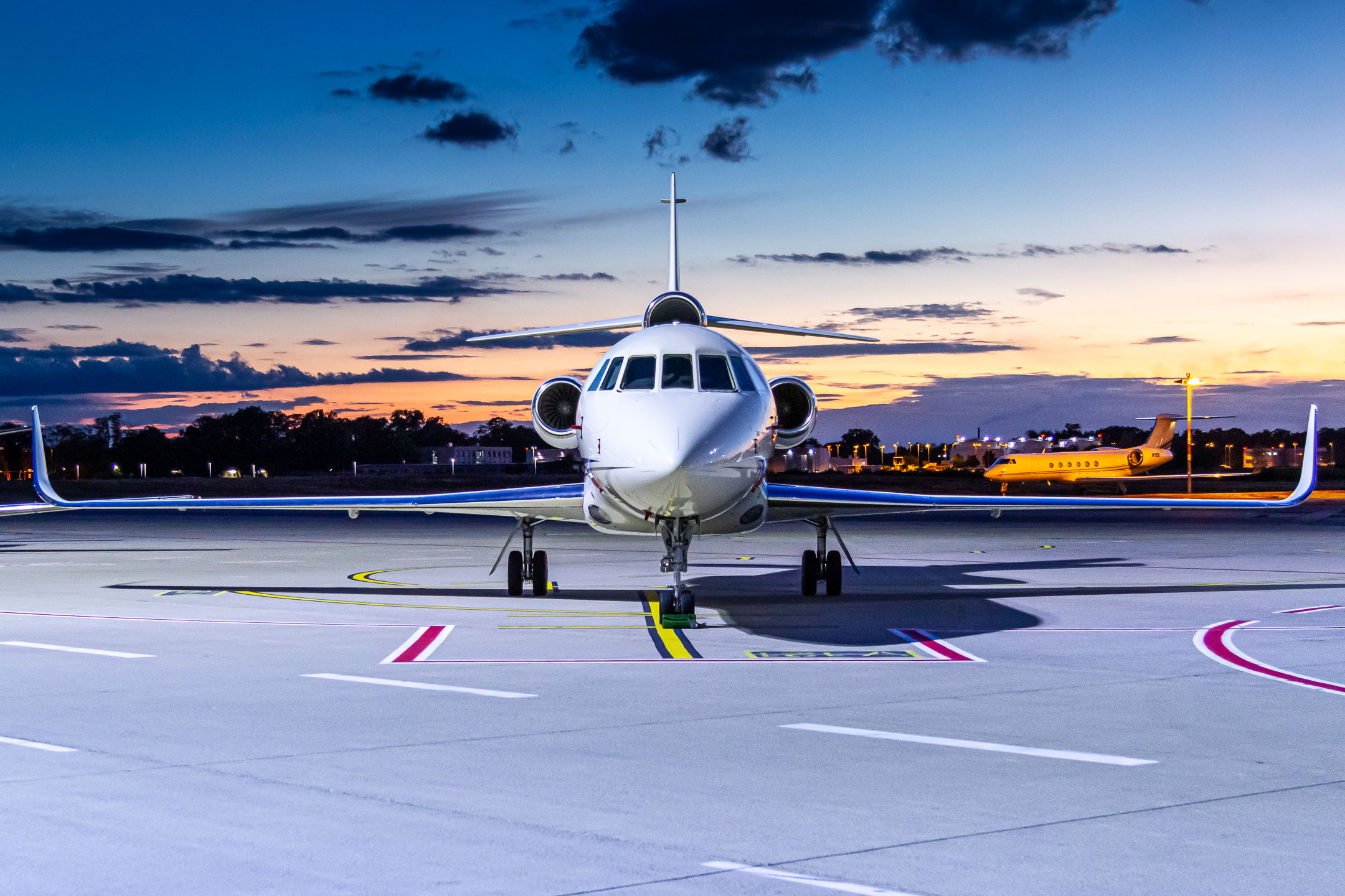 Private Dassault Falcon 900EX "N146EX" waiting at the GAT apron at Köln Bonn Airport for its next flight in the sunset of a beautiful late summer evening, September 2022.