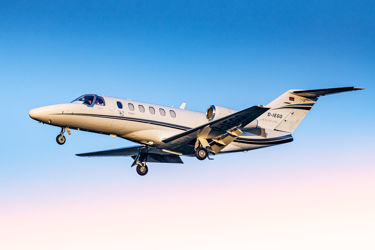 Cessna Citation CJ2+ with callsign "D-IEGO" operated by ProAir coming in on final for runway 32 right at Köln Bonn Airport on a warm late summer evening, September 2022.