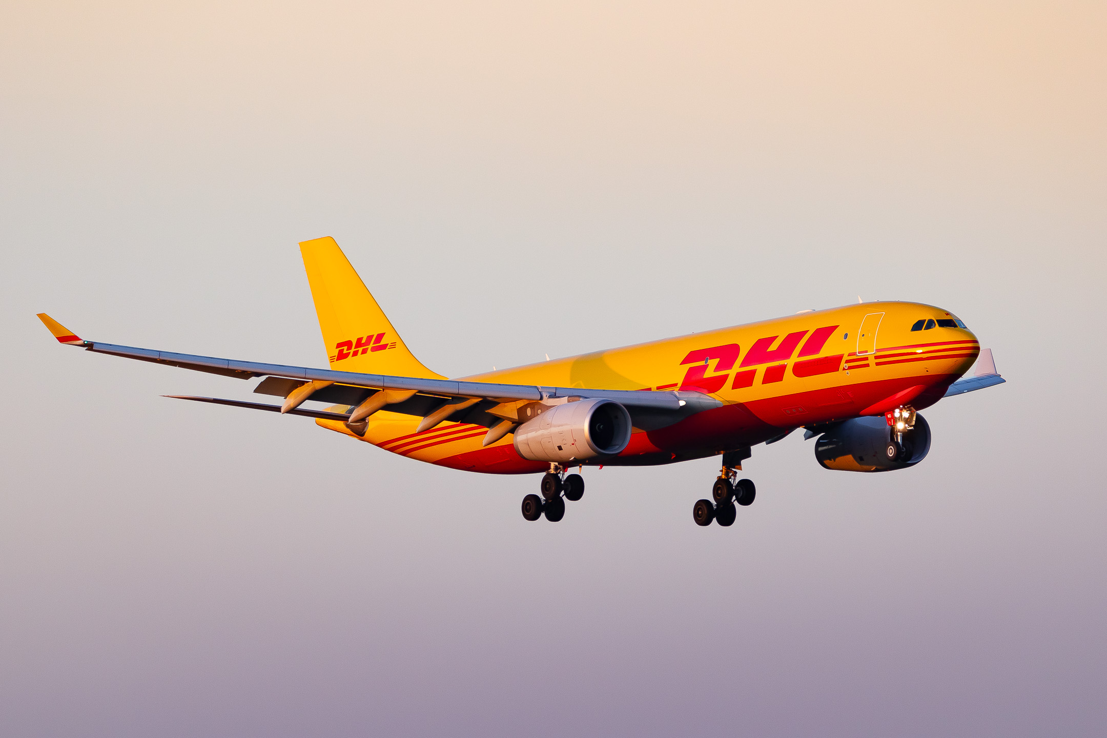 DHL Airbus A330-200F "D-ALMD" coming in on short final for runway 14 left at Köln Bonn Airport on a clear and sunny winter afternoon, November 2022