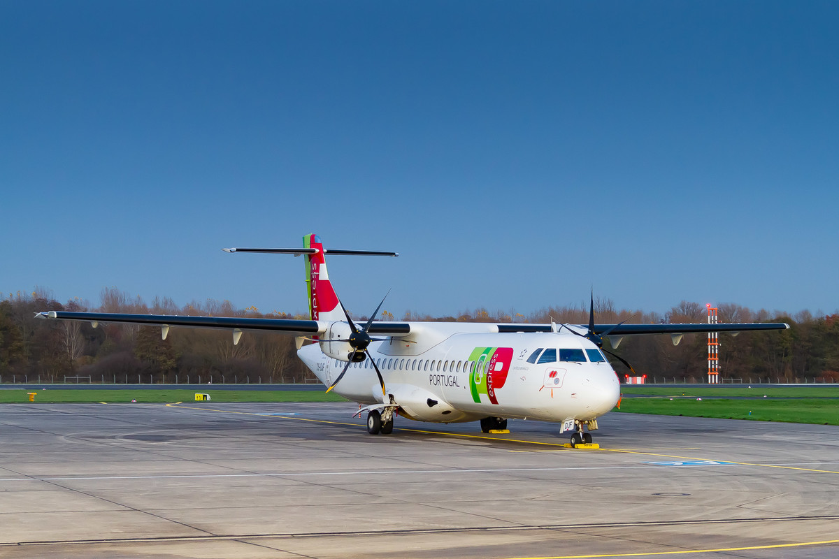 TAP Air Portugal ATR 72 "CS-DJF" parked on the ramp of Mönchengladbach Airport on a cold autumn day, November 2022.