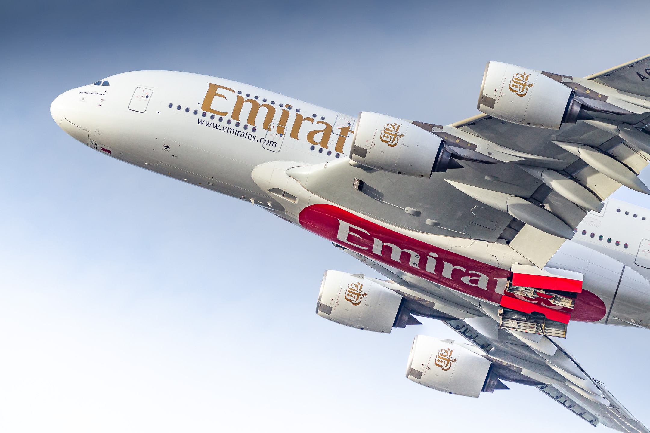 Emirates Airbus A380-800 "A6-EDZ" taking off from runway 23 left at Düsseldorf Airport on a clear and bright winter afternoon, November 2011