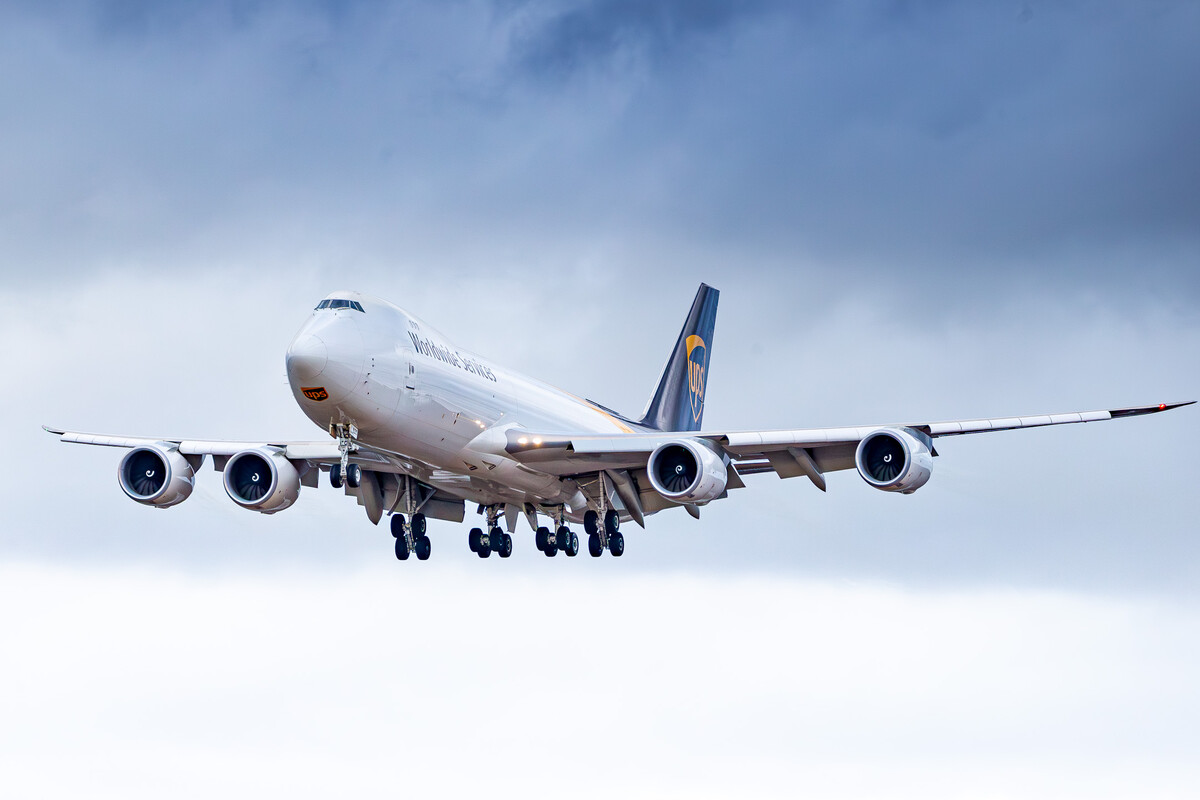 UPS Airlines Boeing 747-8F ("N620UP") on short final for runway 24 (runways 14/32 were closed due to maintenance) at Köln Bonn Airport on a cloudy dark winter afternoon, January 2023