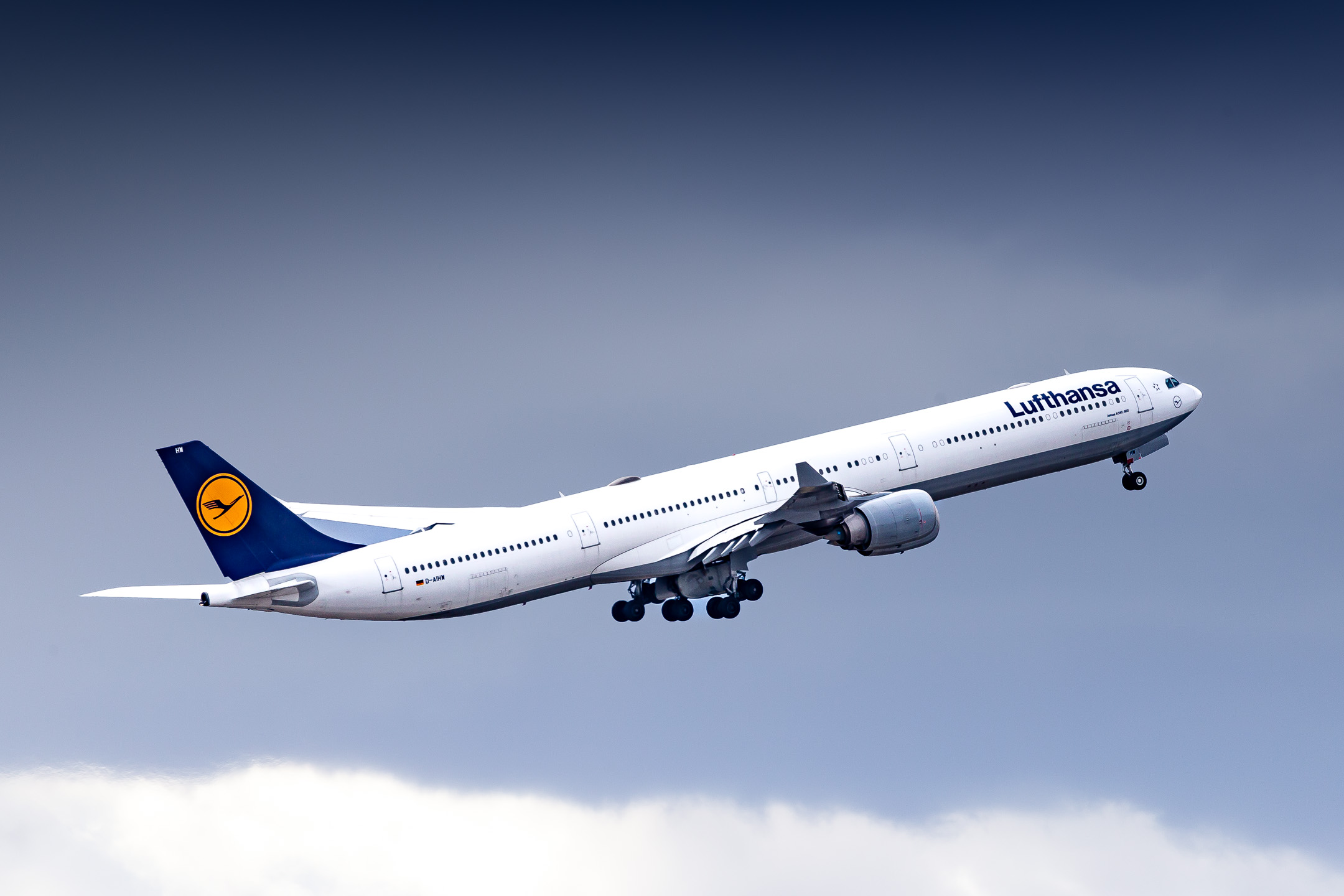 Lufthansa Airbus A340-600 "D-AIHW" taking off from runway 26 left at München Airport on a cloudy winter afternoon, February 2023