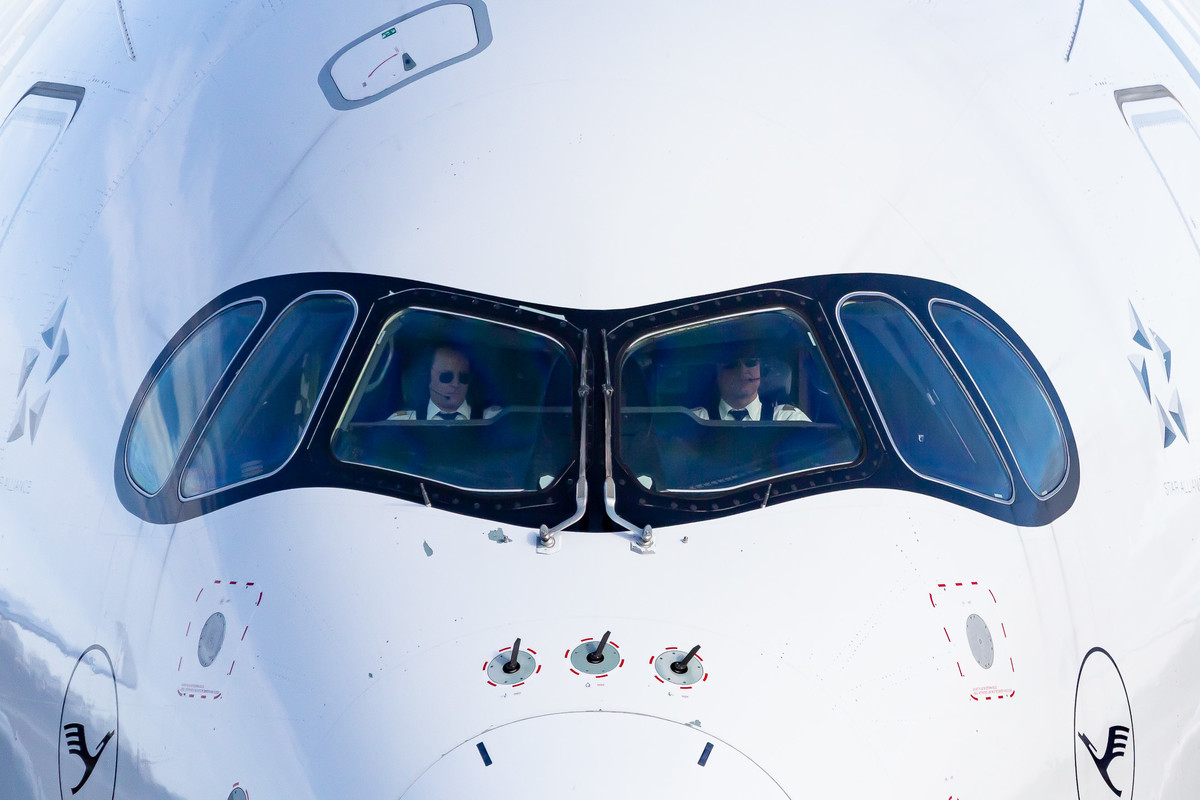 Lufthansa Airbus A350-941 taxiing via Alpha 6 back to the ramp (registration "D-AIXJ") after a short flight from Frankfurt Airport to Munich Airport on February 20th, 2023 