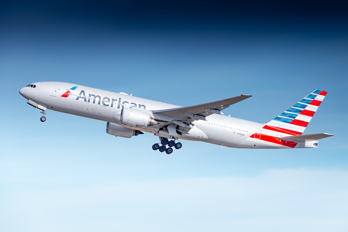 American Airlines Boeing 777-200 "N766AN" departing from runway 26R at München Airport on a warm winter morning on February 20th, 2023 