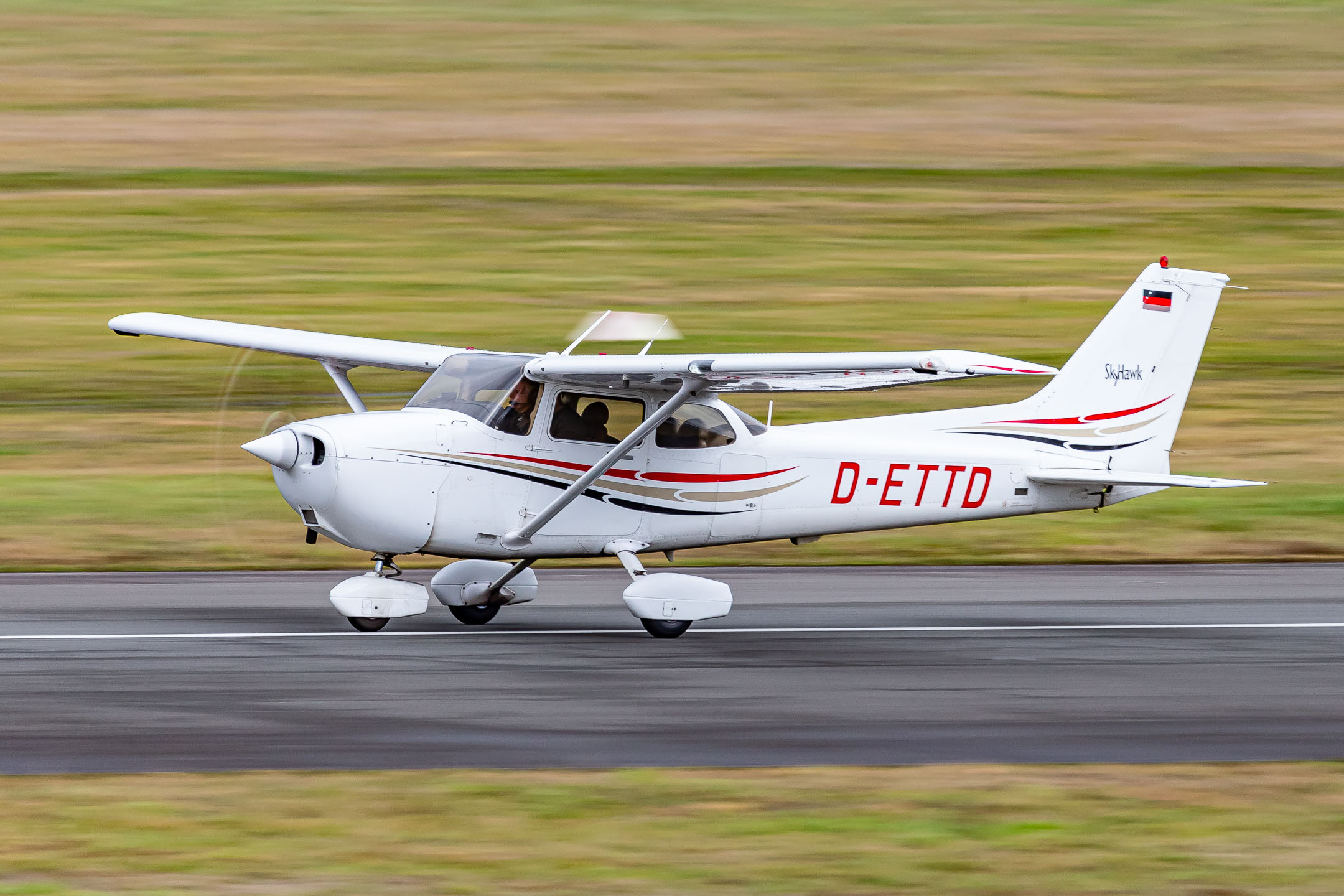 Cessna 172R Skyhawk "D-ETTD" of ATC Aviation Training and Transport Center in Bonn-Hangelar during some touch and gos on a cloudy spring afternoon, March 2023.