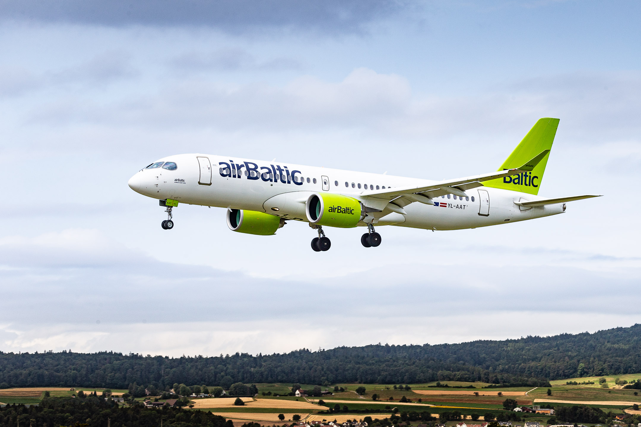 Air Baltic Airbus A220-300 "YL-AAT" right before touchdown on runway 16 at Zürich Kloten Airport, July 2023.