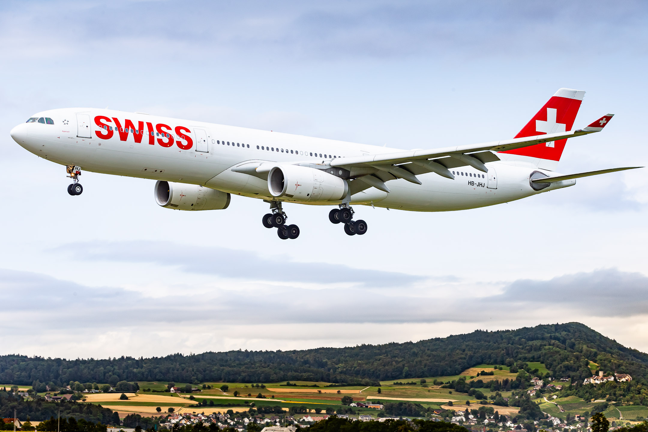 Swiss Airbus A330-343 "HB-JHJ" on short final for runway 16 at Zürich Kloten Airport, July 2023.