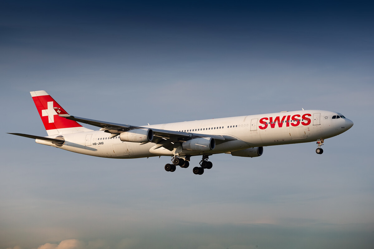 Swiss Airbus A340-300 "HB-JMB" on short final for runway 14 at Zürich Airport on a hot and sunny summer afternoon, July 2023