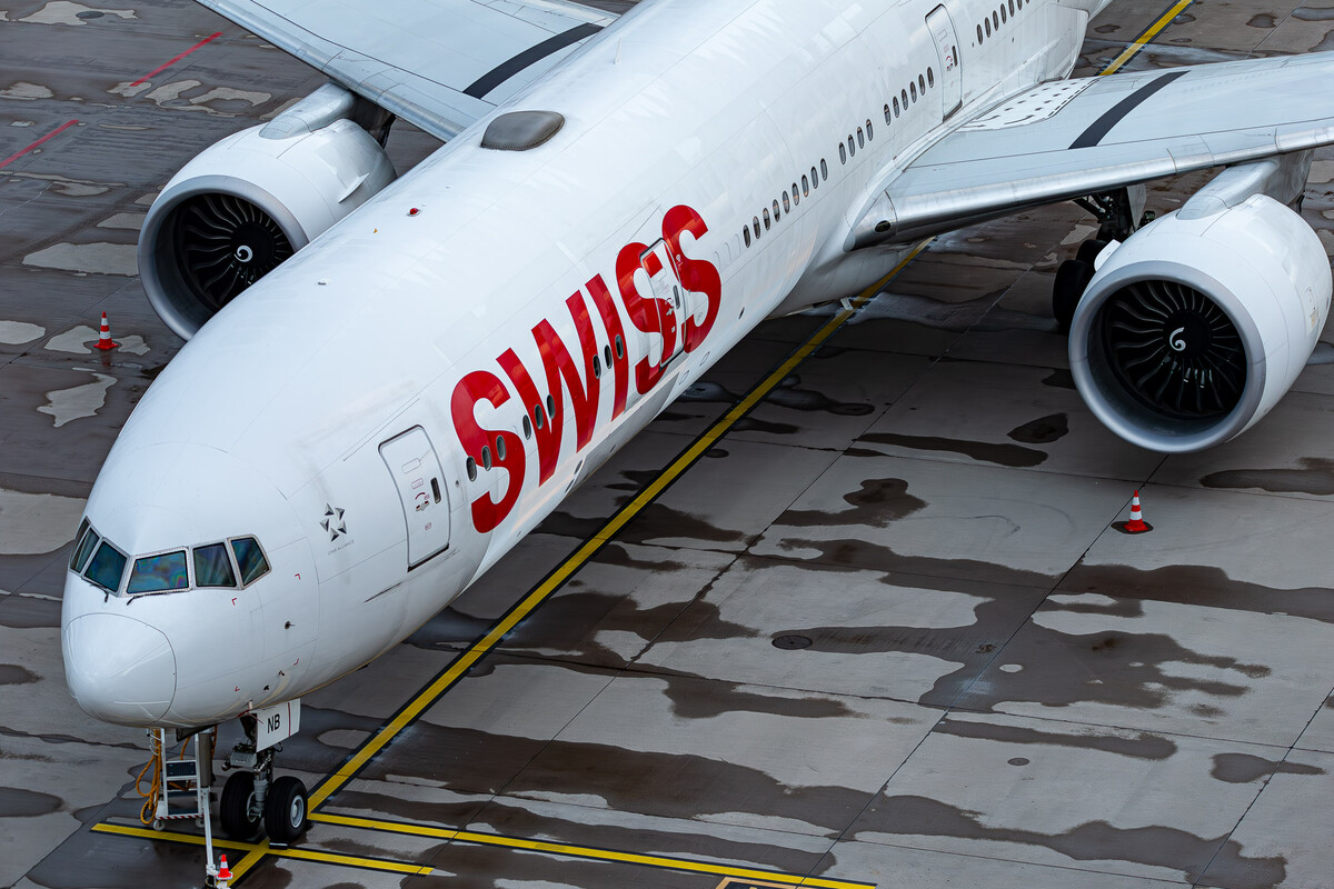 Swiss Boeing 777-300ER "HB-JNB" parked on the apron at Zürich Kloten Airport just a few hours before departing to Los Angeles (LAX) Airport, July 2023.