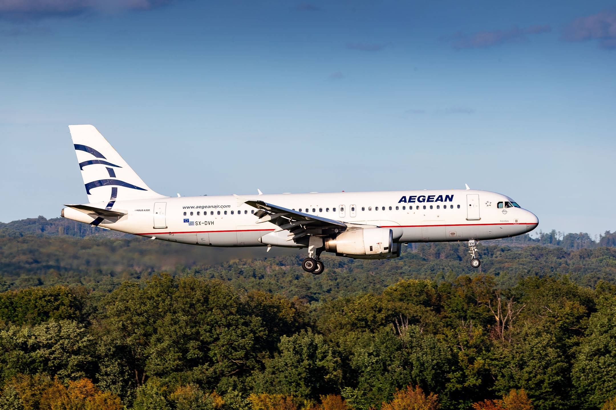 Aegean Airlines Airbus A320-200 "SX-DVH" right before touchdown on runway 14L at Köln Bonn Airport on a warm and sunny late summer afterboon, September 2023