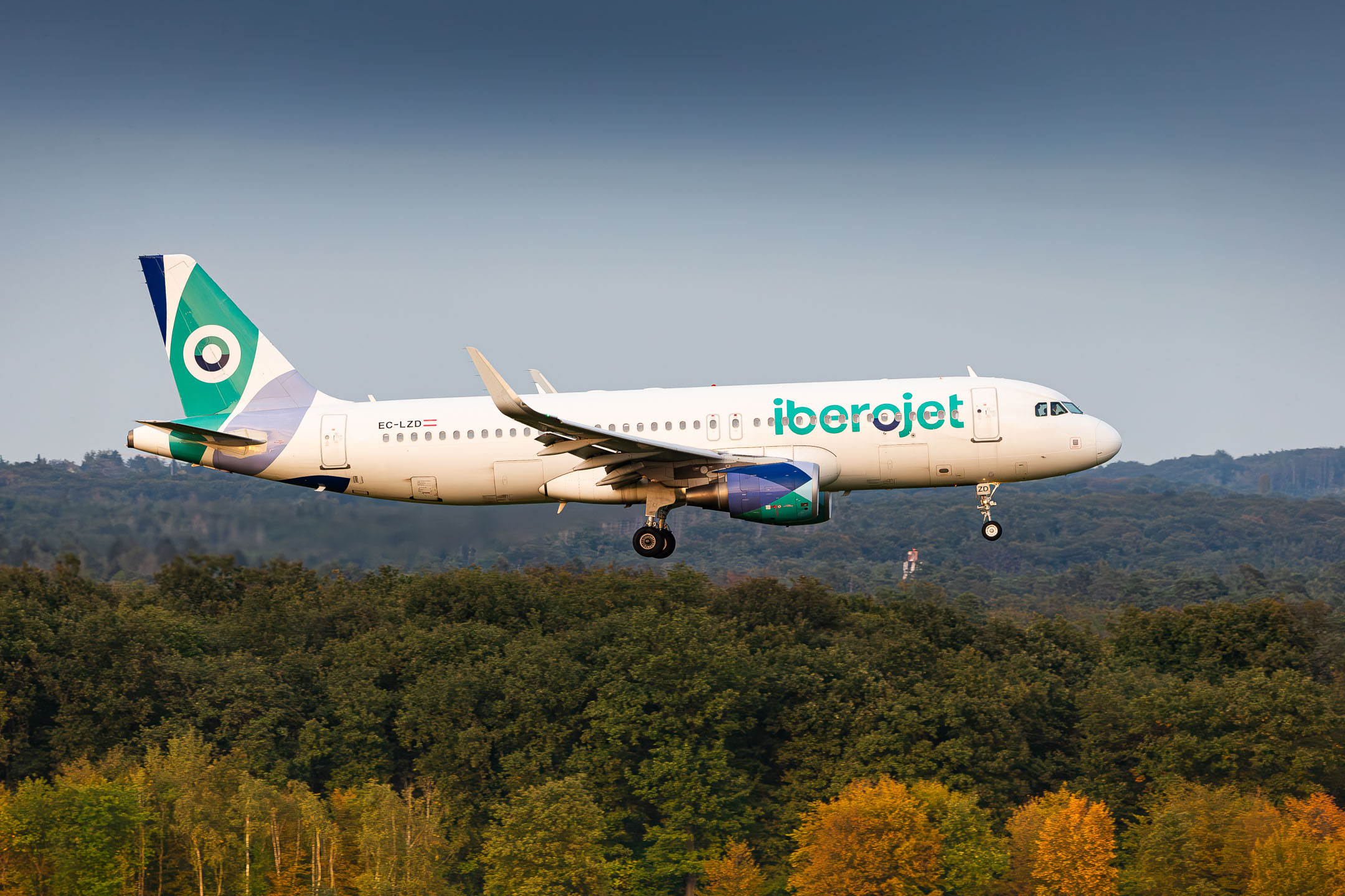 Iberojet Airbus A320-200 "EC-LZD" on short final for runway 14L at Köln Bonn Airport on a warm late summer evening, September 2023