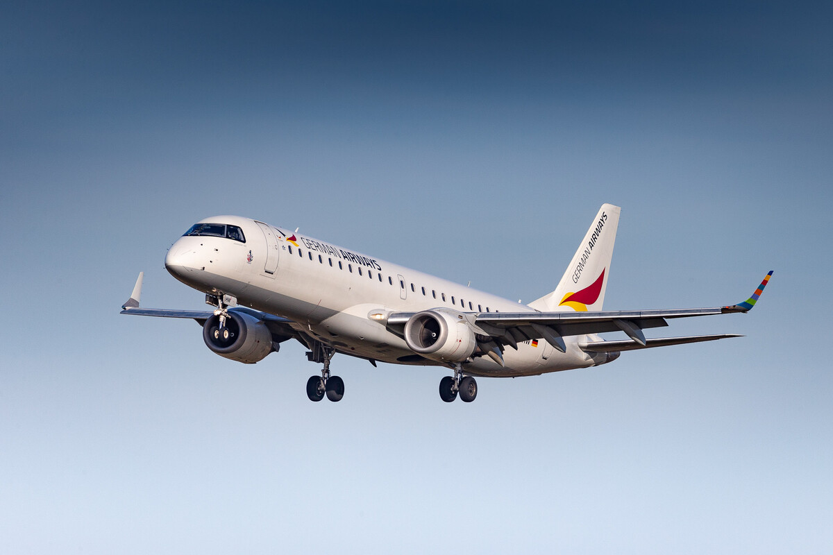 German Airways Embraer ERJ-190LR "D-AJHW" coming in on short final for runway 23L at Düsseldorf Airport on a bright and sunny winter afternoon, January 2024.