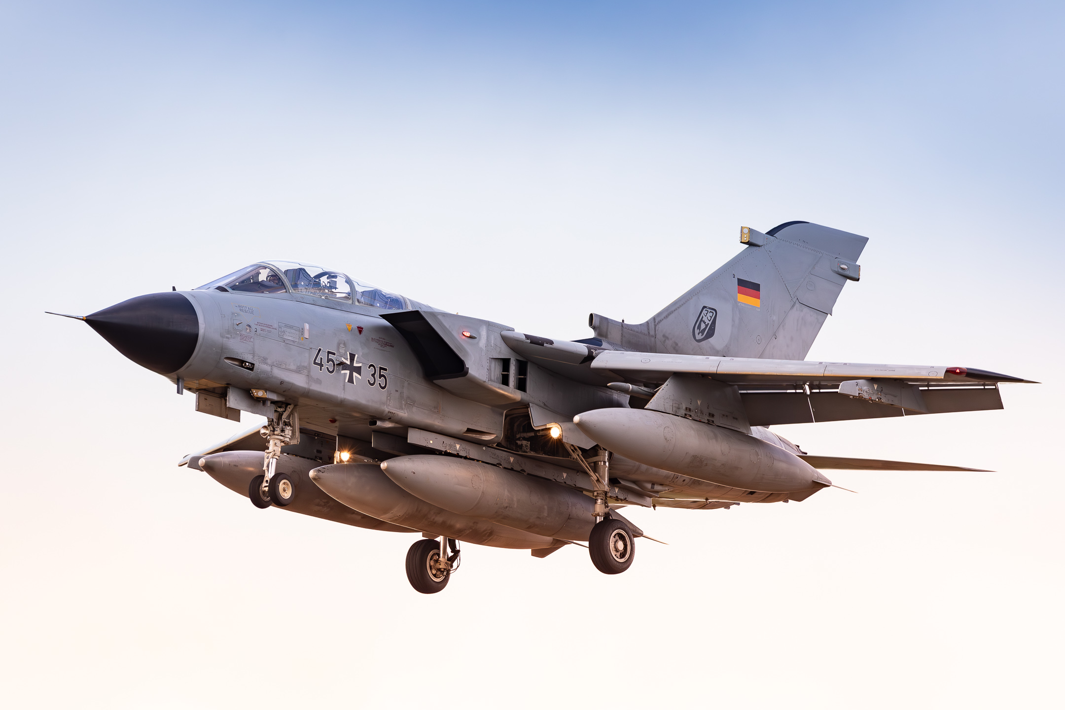 Luftwaffe Panavia Tornado IDS "45+35", currently located at Nörvenich Air Base due to construction works at its homebase Büchel, on short final for runway 25 on a hazy afternoon, April 2024