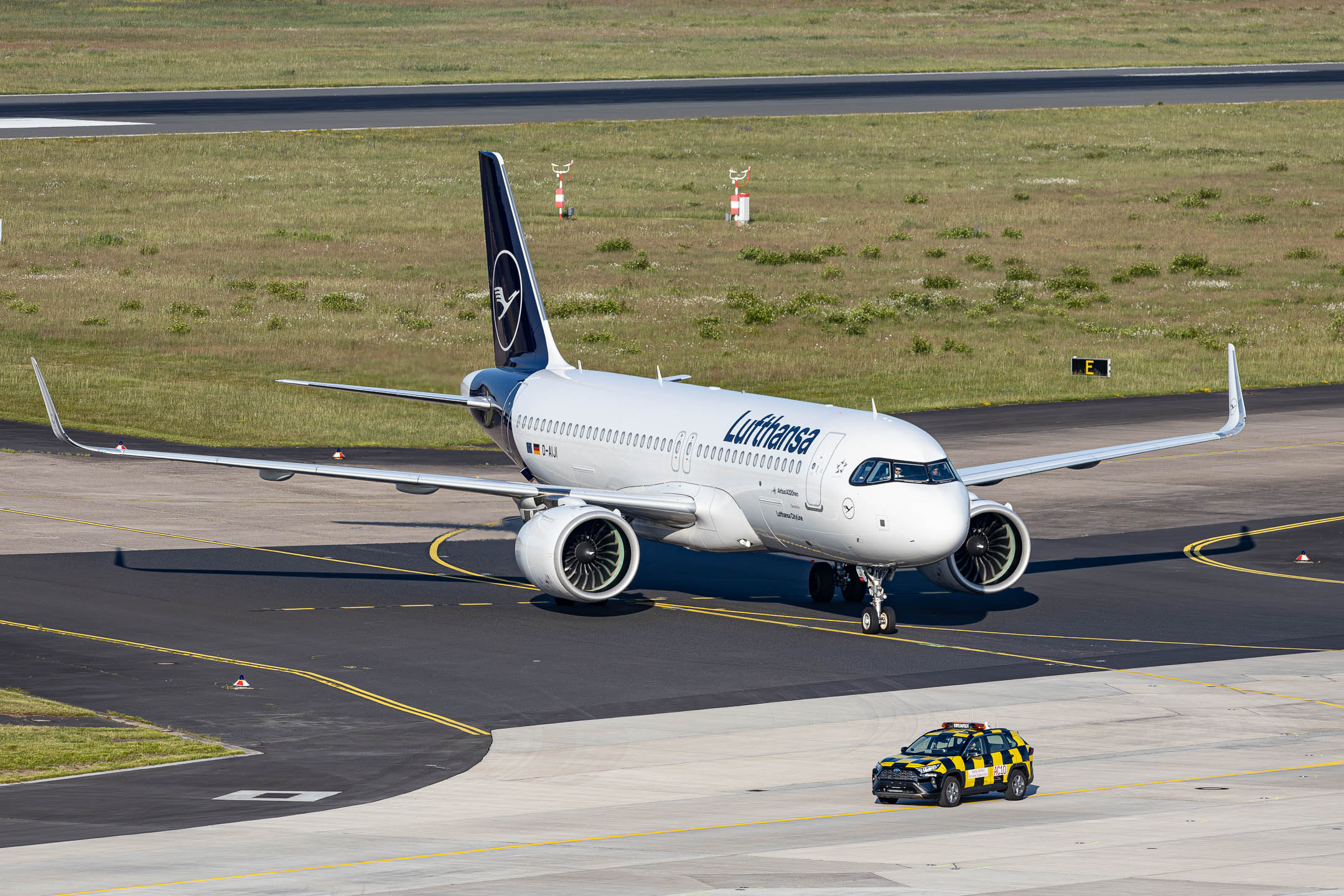 Lufthansa Airbus A320-200neo "D-AIJI" taxiing to the stand after touching down on runway 31 right at Köln Bonn Airport on a early summer evening, June 2024