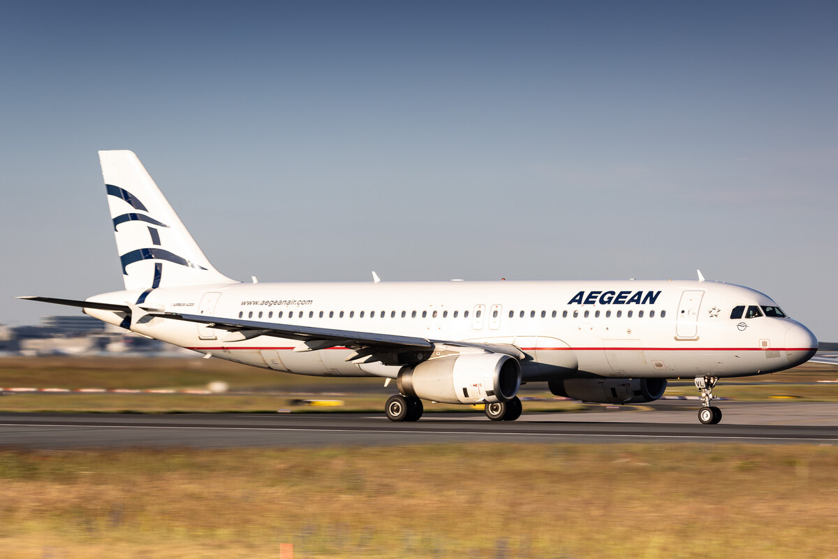 Aegean Airlines Aribus A320-200 "SX-DVL" accelerating on runway 18 at Frankfurt Airport on a sunny afternoon, June 2024